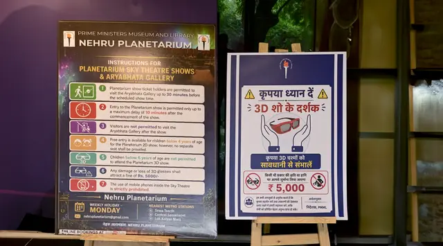 Nehru Planetarium signage listing instructions for Sky Theatre shows, the Aryabhata Gallery, and 3D show viewers